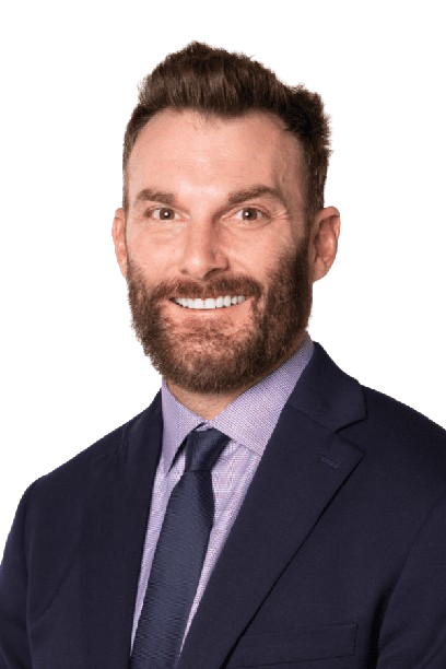 Smiling man in a navy suit and tie on a white background