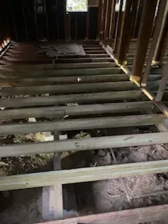 A picture of a wooden floor in a house under construction.