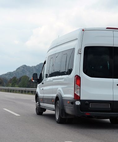 Large minivan driving a scenic road | American Five Star Auto Repair & Transmission