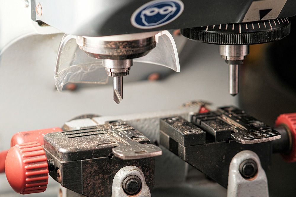 A Close Up of a Machine Cutting Two Keys — The Skeleton Key Locksmiths & Security in West Tamworth, NSW