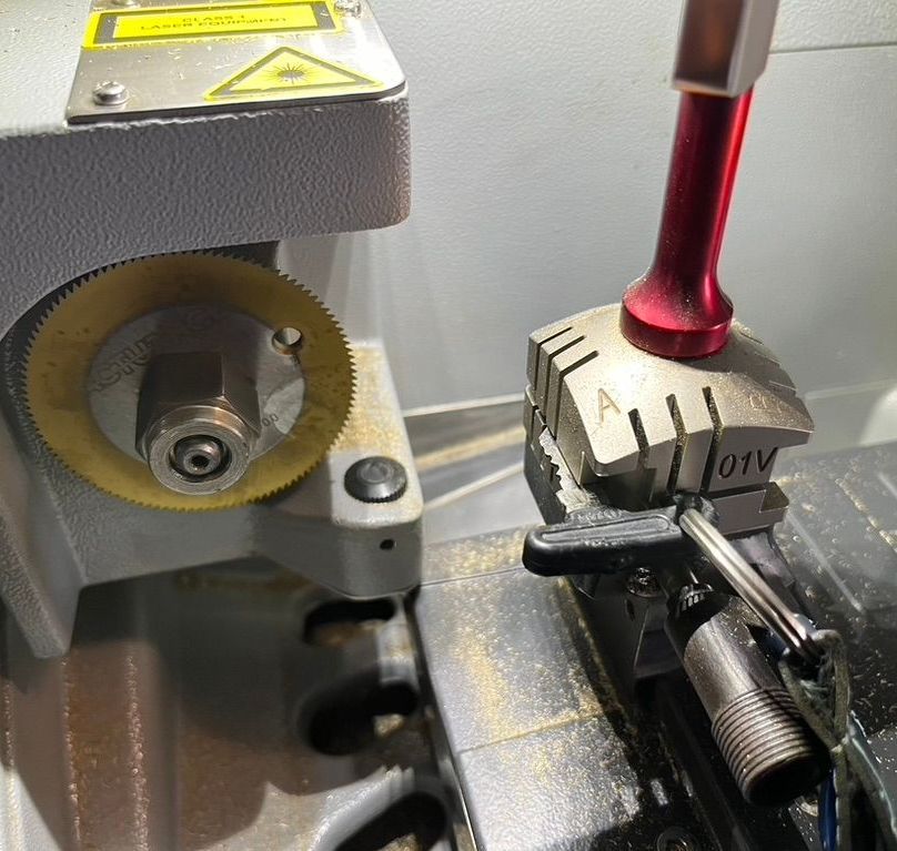A Close Up of a Machine That is Cutting a Key — The Skeleton Key Locksmiths & Security in West Tamworth, NSW