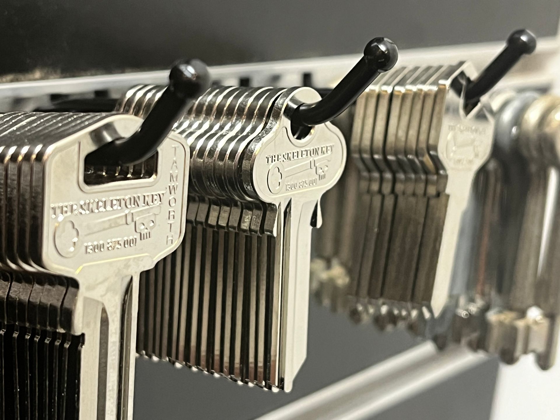 A Bunch of Keys Are Hanging on a Rack — The Skeleton Key Locksmiths & Security in West Tamworth, NSW