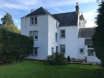 Professional exterior masonry painting on a large three-story white residential home in Lanarkshire, completed by award winning firm Kirkdec.