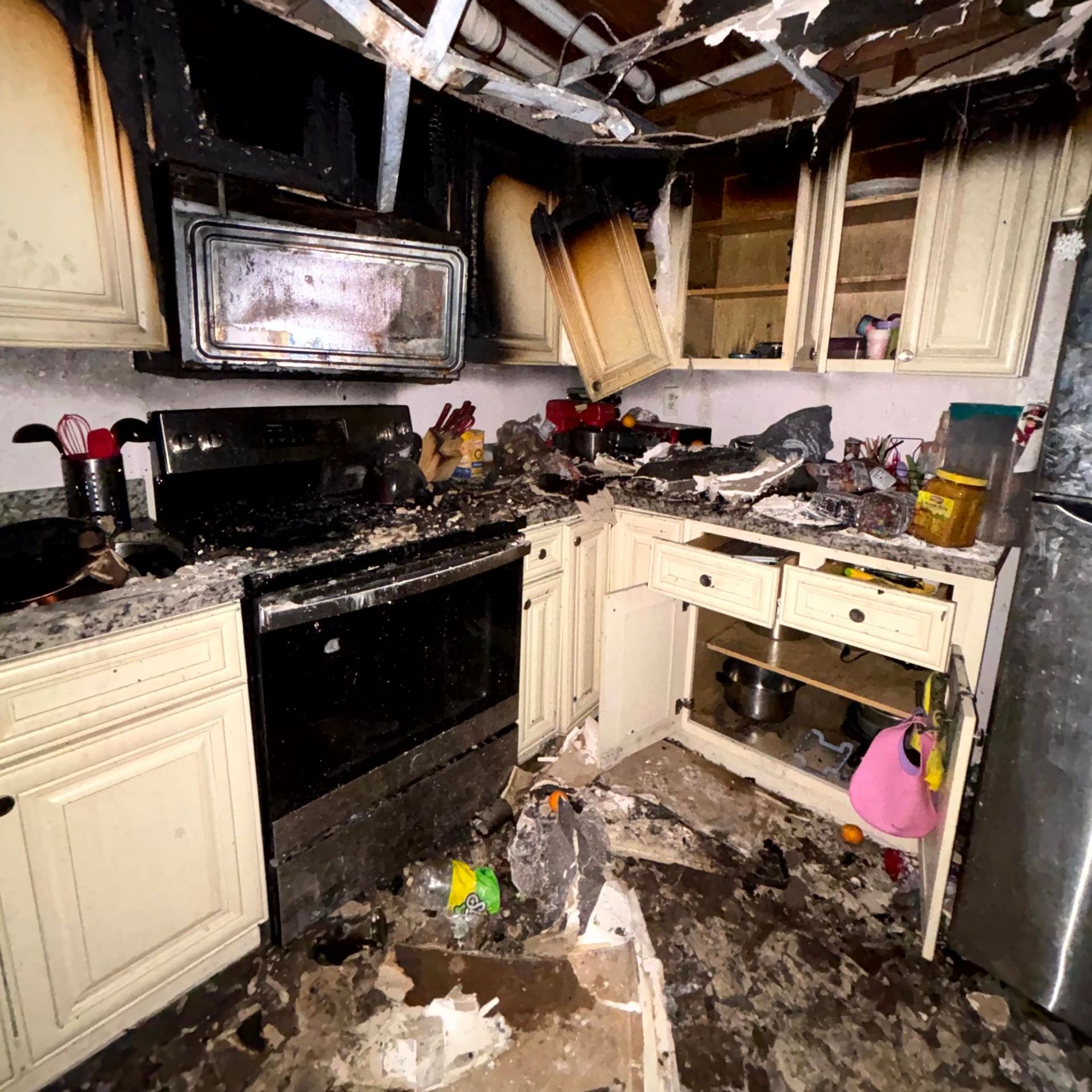 A kitchen that has been damaged by a fire