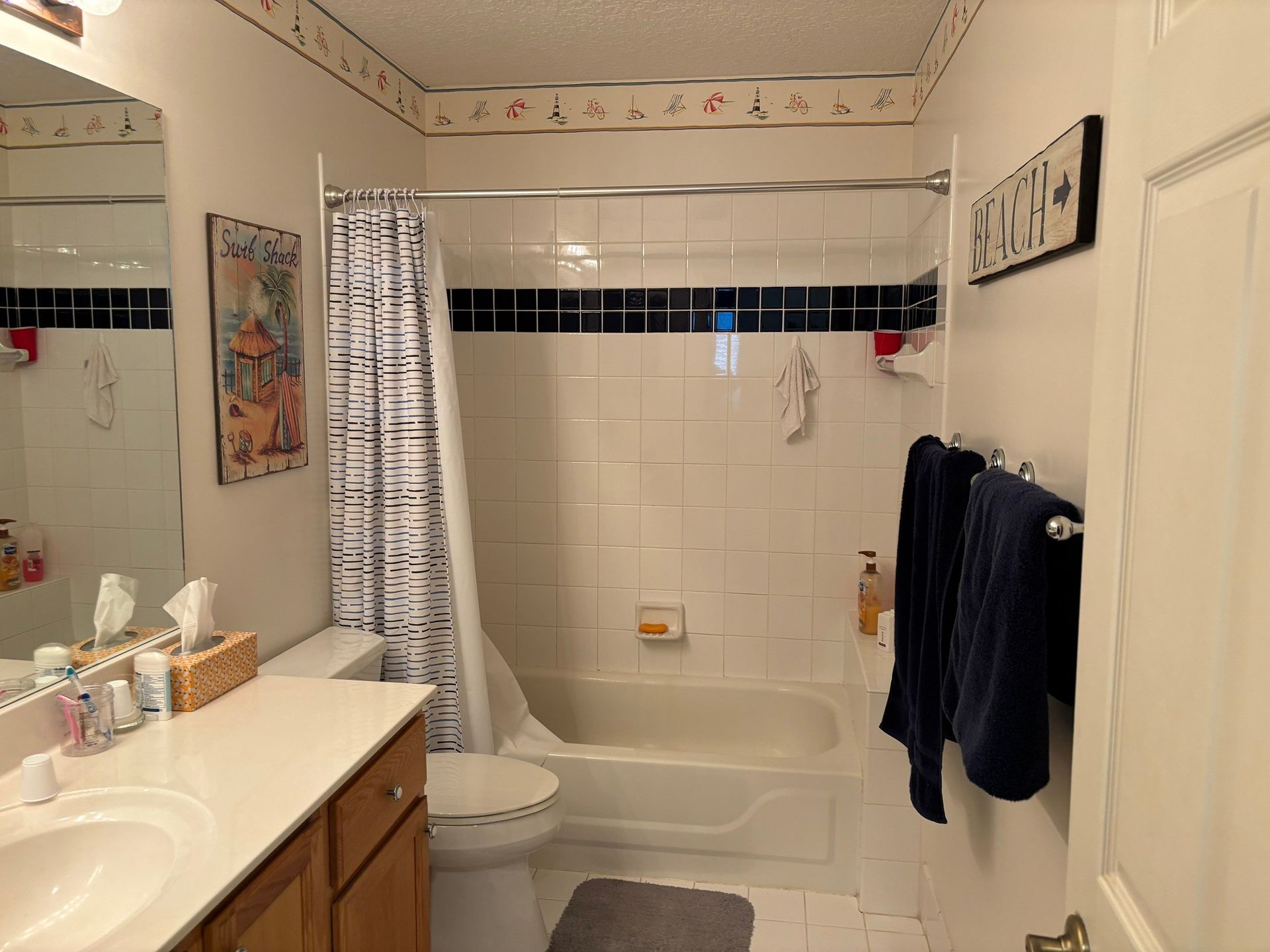 A bathroom with a sink , toilet and mirror