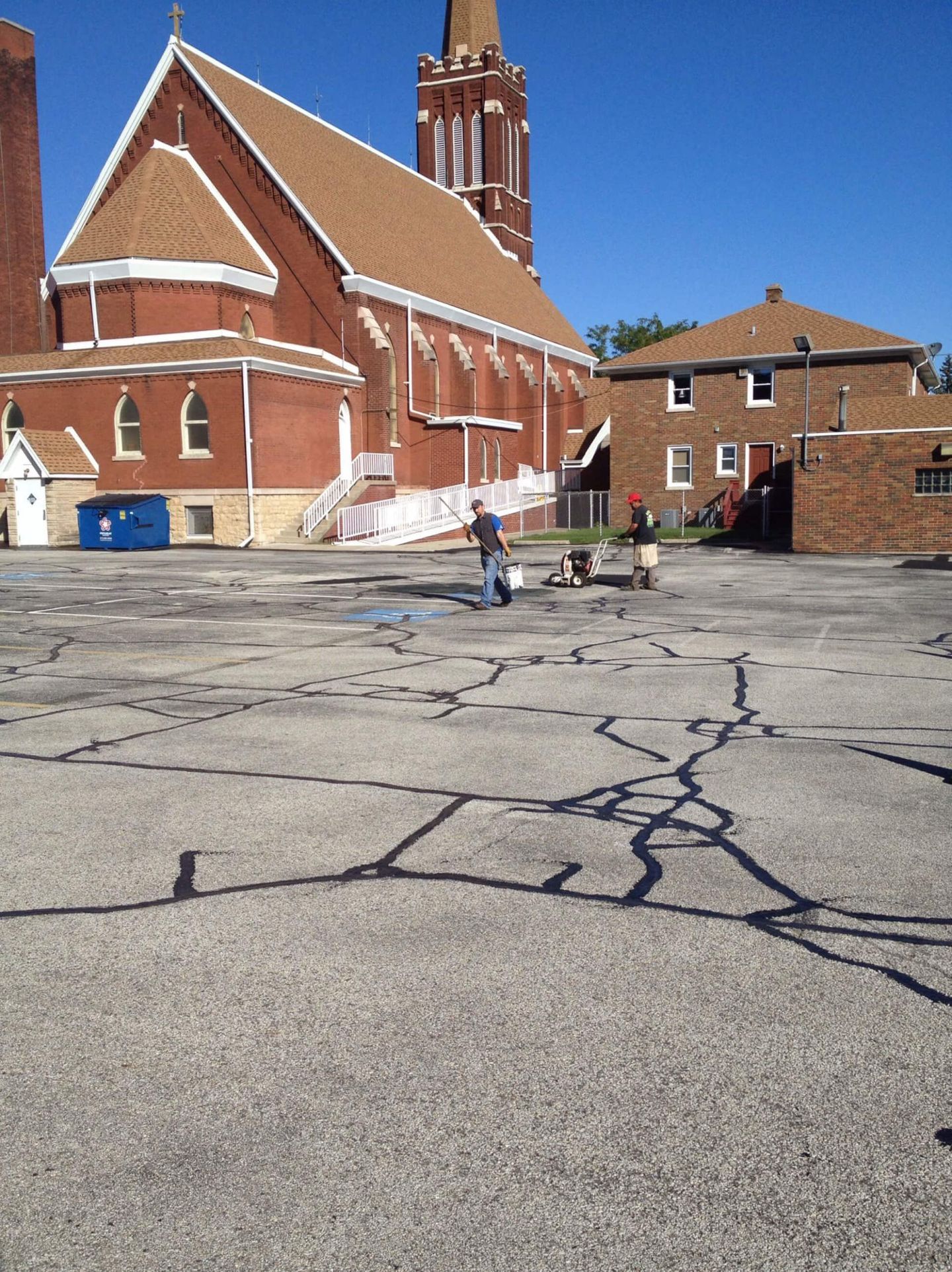 Crack Sealing With Workers — Schereville, IN — Ristich Asphalt Paving Inc