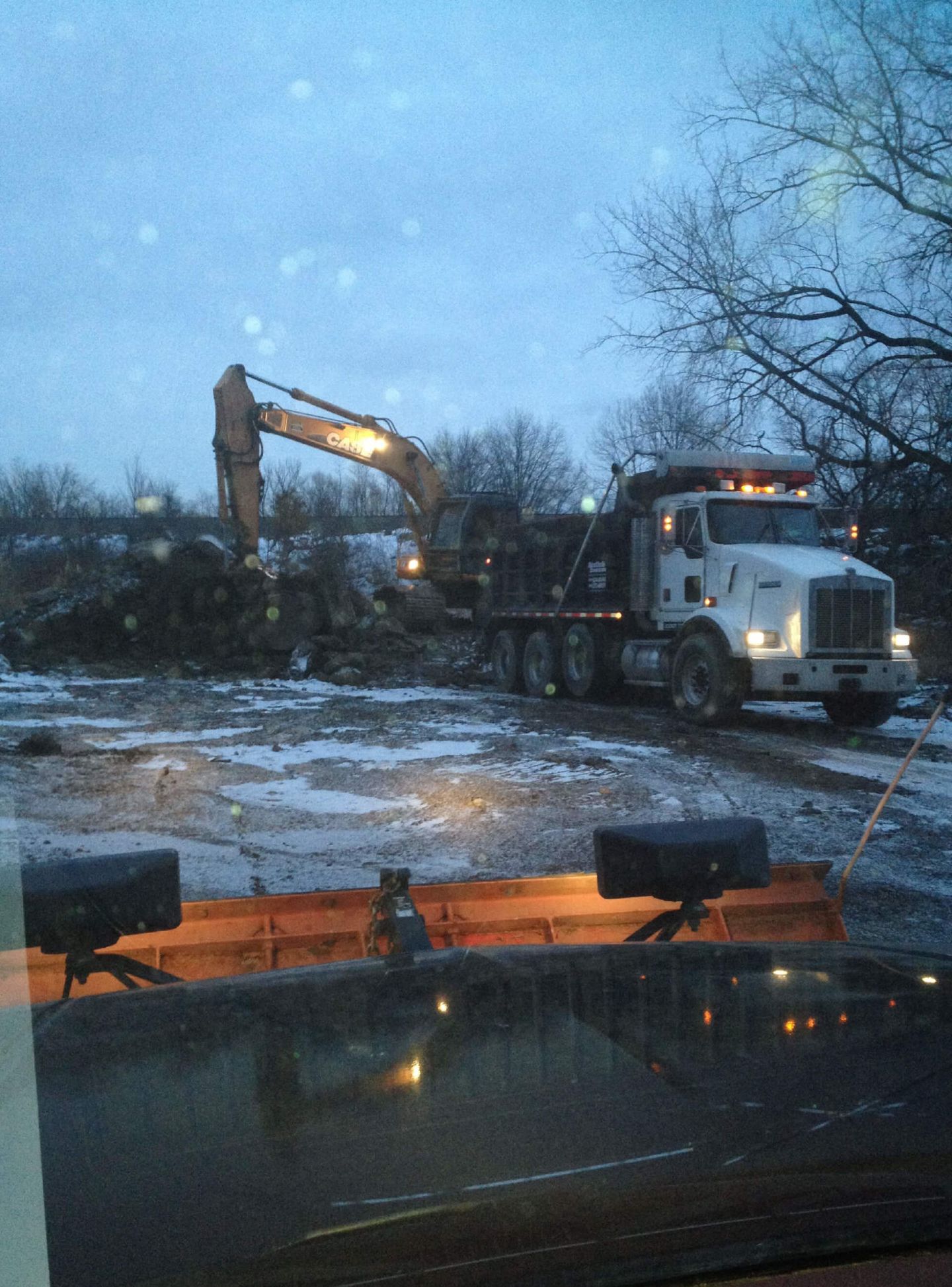 Trucks In Construction Site — Schereville, IN — Ristich Asphalt Paving Inc