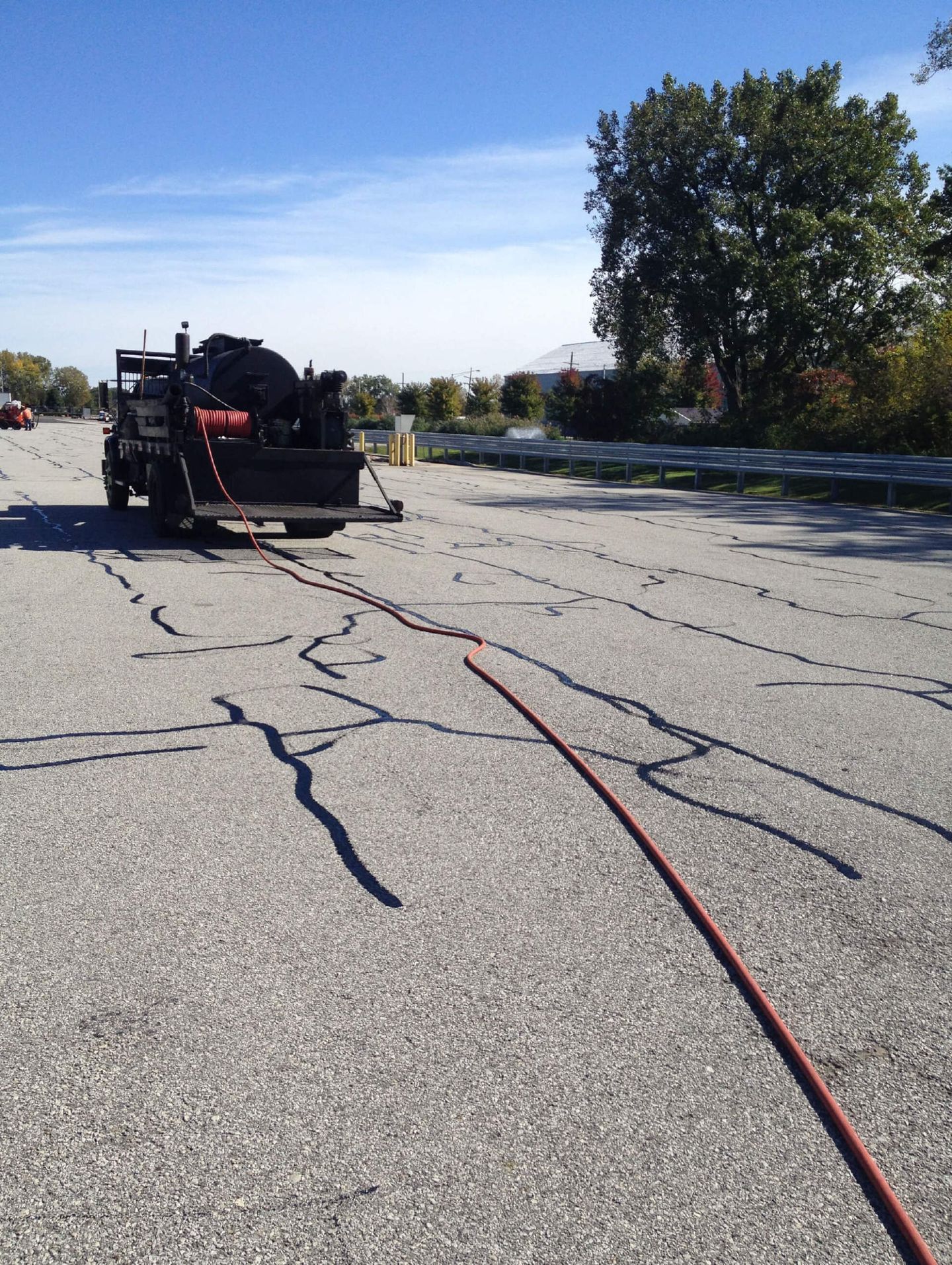 Hot Crack Filling With A Truck — Schereville, IN — Ristich Asphalt Paving Inc