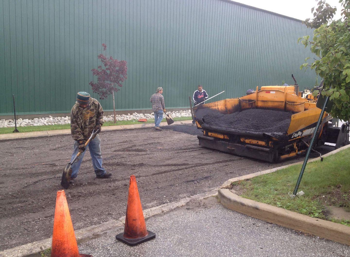 Asphalt Is Unloaded From A Wheelbarrow — Schereville, IN — Ristich Asphalt Paving Inc