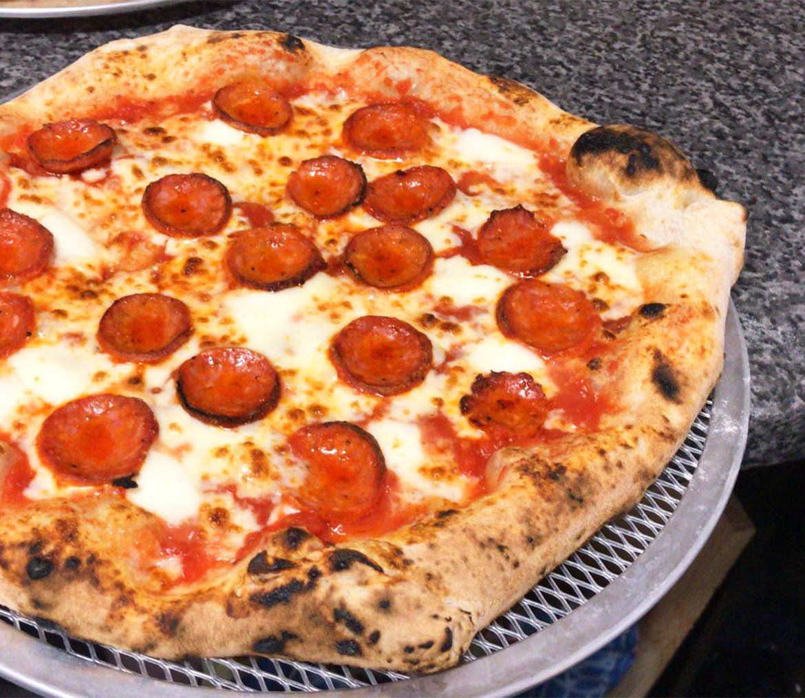 Stone-baked pepperoni pizza fresh out the oven