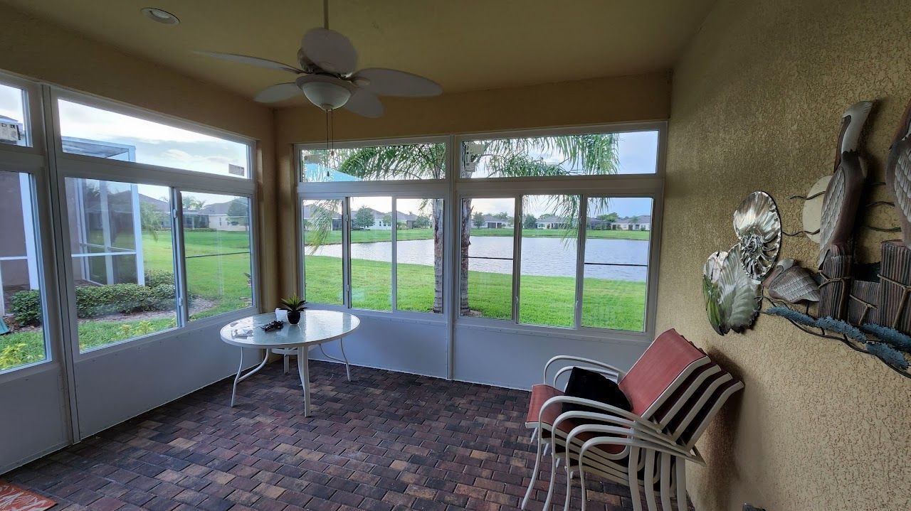 Screened Tampa Bay lanai with storm windows for weather and wind protection