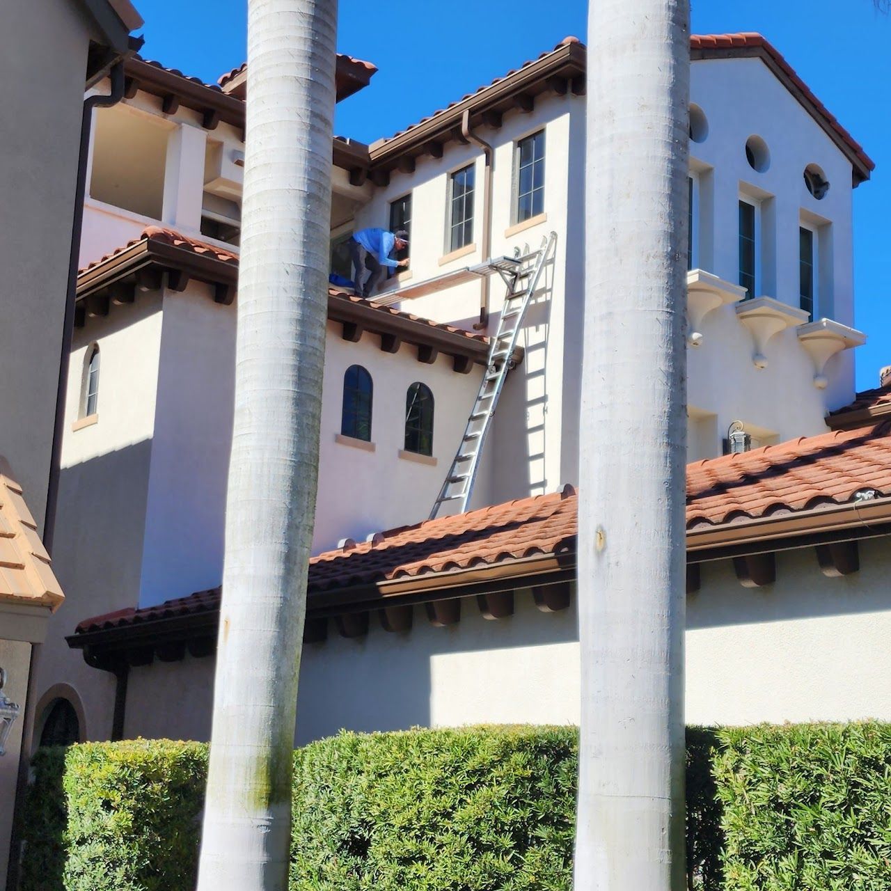 Installing hurricane impact windows on Mediterranean-style Tampa Bay residence