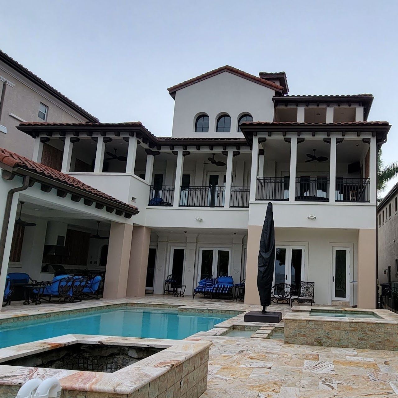 Hurricane windows and impact doors on Tampa Bay luxury home with covered patio