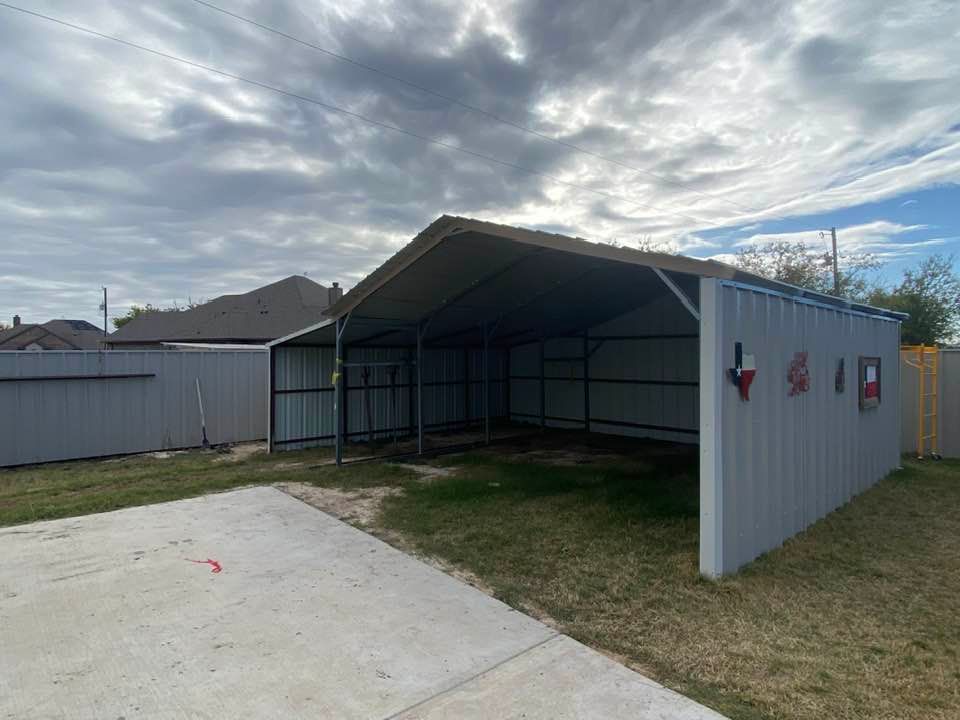 There is a carport in the backyard of a house.
