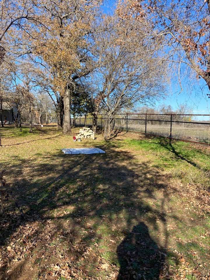 There is a picnic table in the middle of the park.