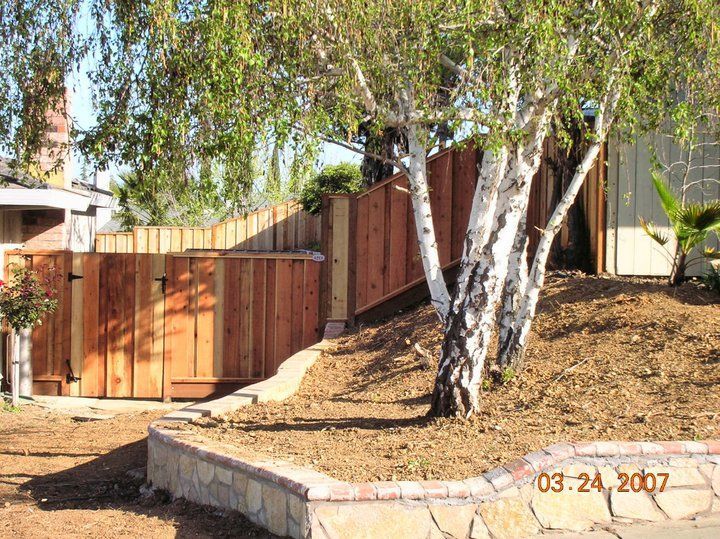 A picture of a wooden fence taken on march 24 2007