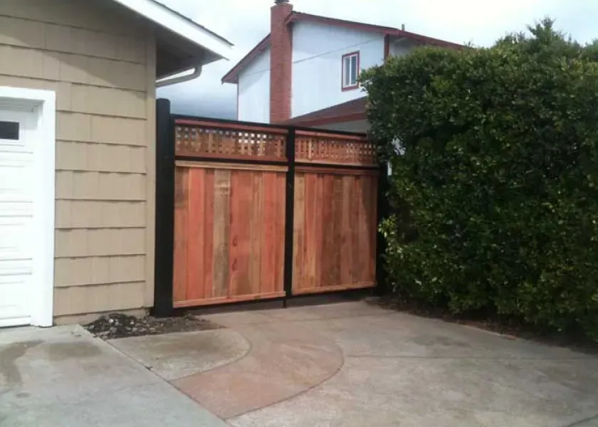A house with a wooden gate in front of it