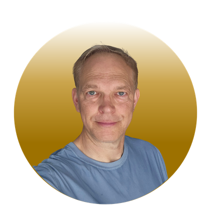 A middle-aged man with fair skin and a tan hat smiles at the camera, set against a golden gradient background.