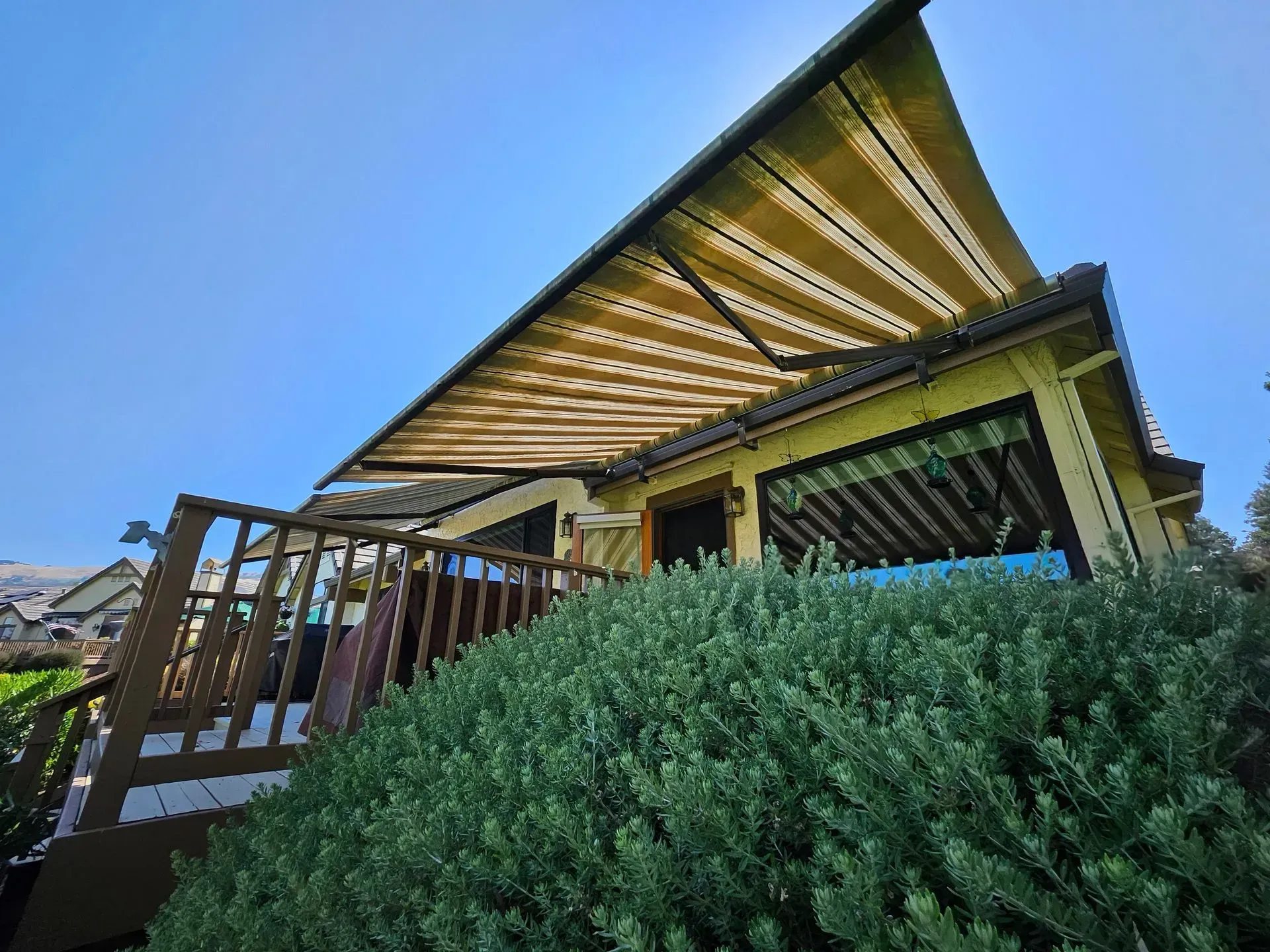 A large empty room with a ceiling that has lights hanging from it
