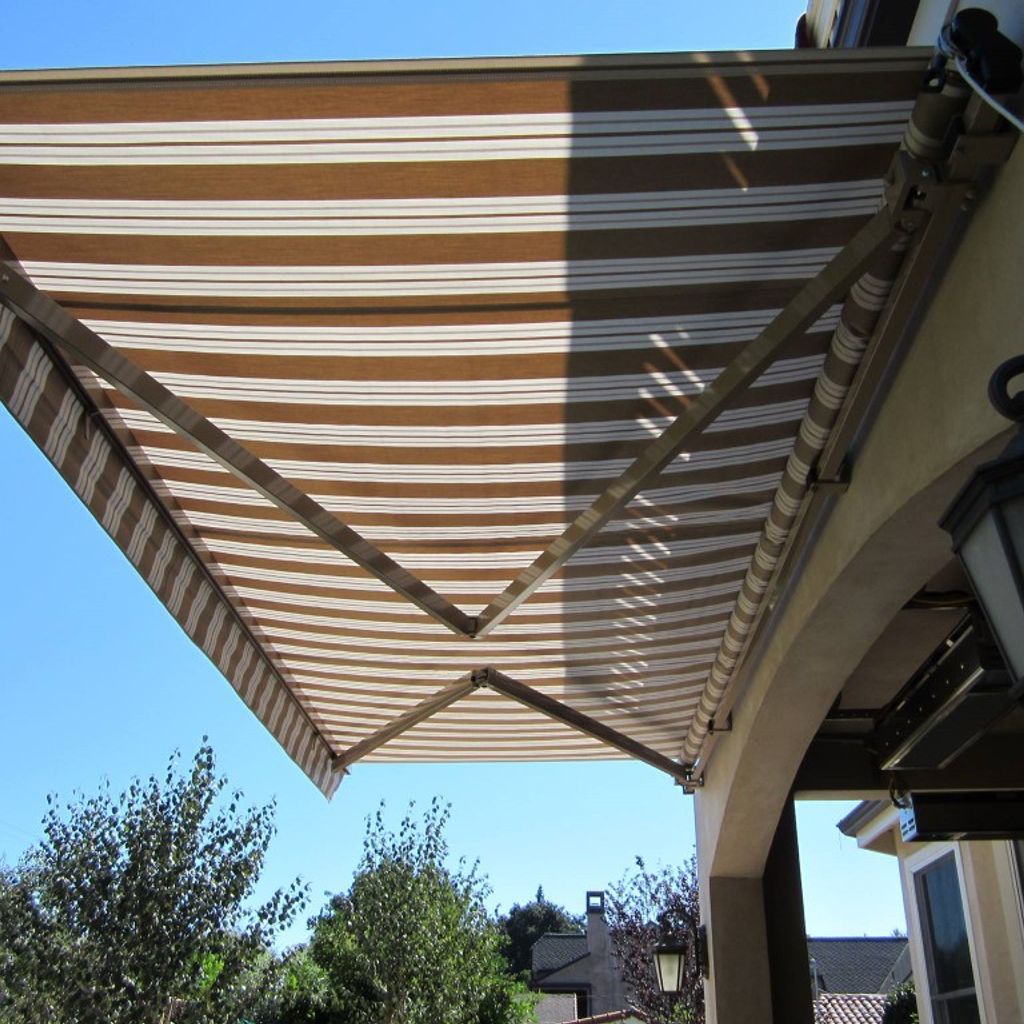 A brown and white striped awning over a porch