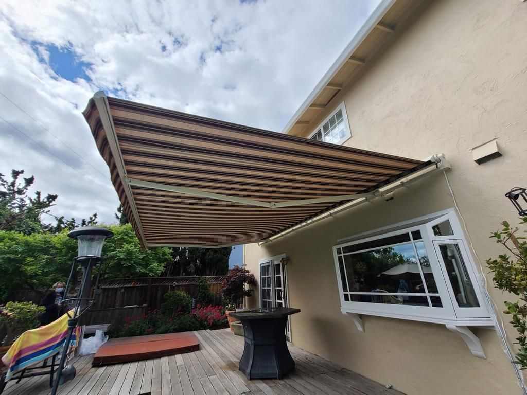 A house with a large awning on the side of it.