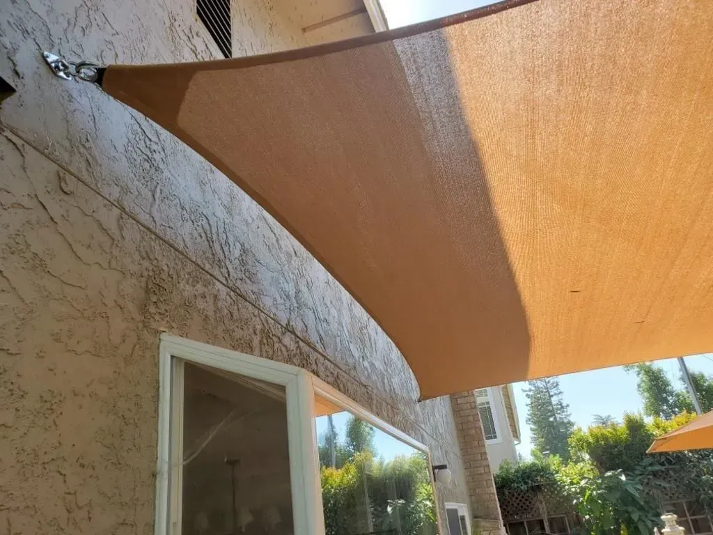 A large empty room with a ceiling that has lights hanging from it