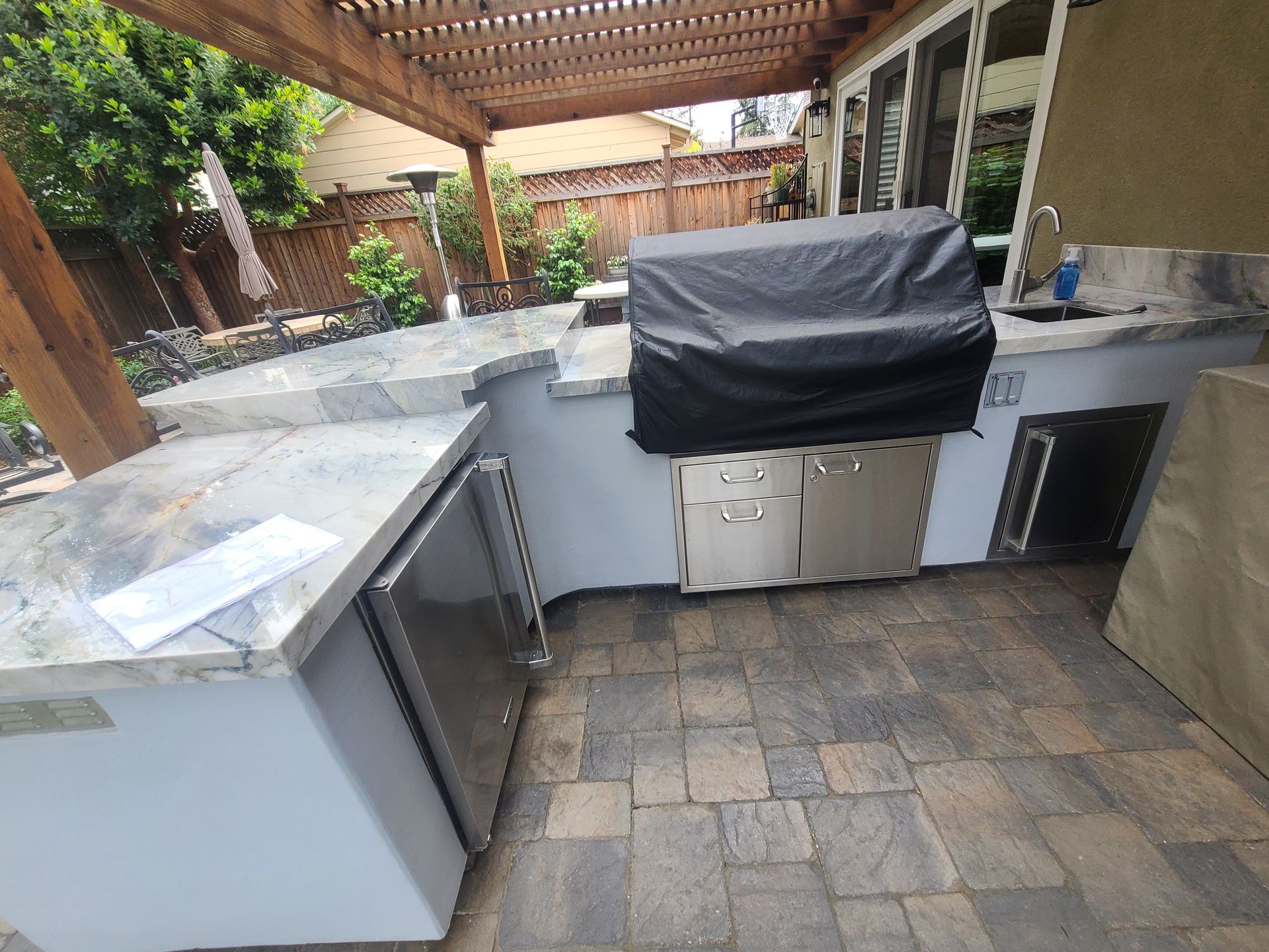 A green and white awning is on the side of a building.