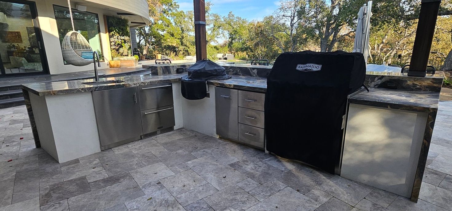 A red awning is hanging from the side of a building