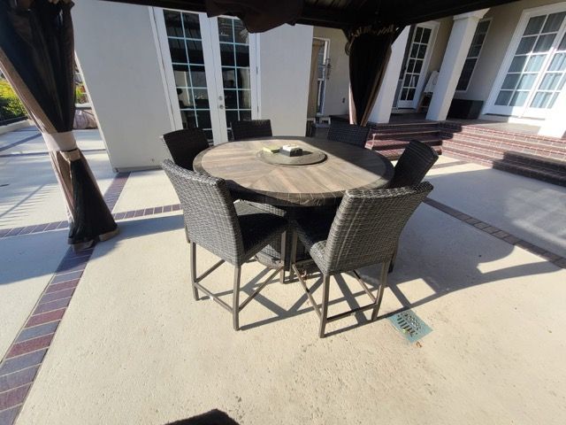 A green and white awning is on the side of a building.