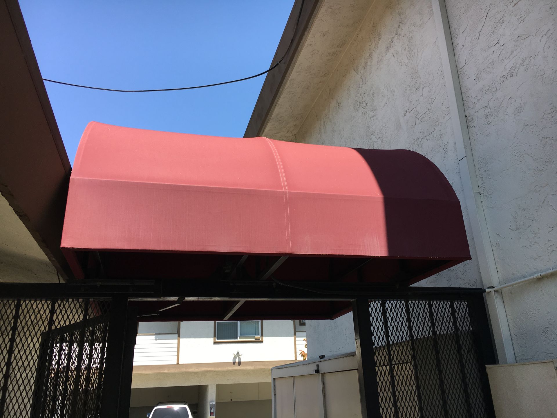 A sign for cook 's seafood with a blue awning