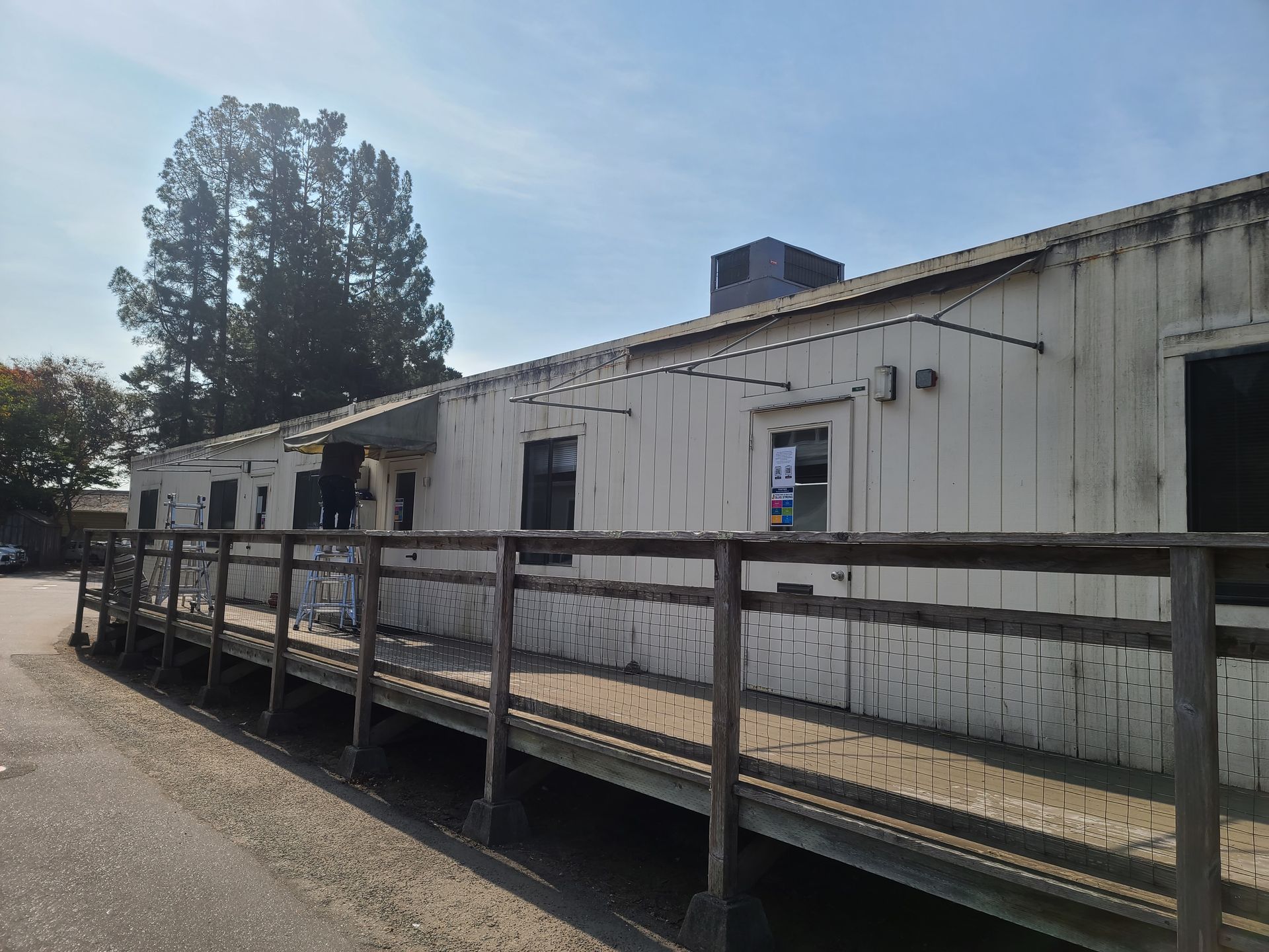 A before and after photo of a red and white striped awning
