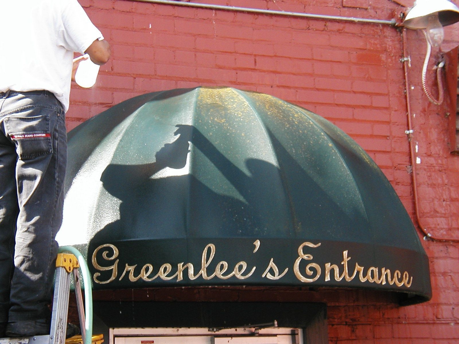 A before and after picture of a red building.