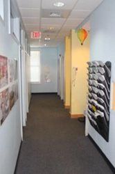 A long hallway with a hot air balloon on the wall.