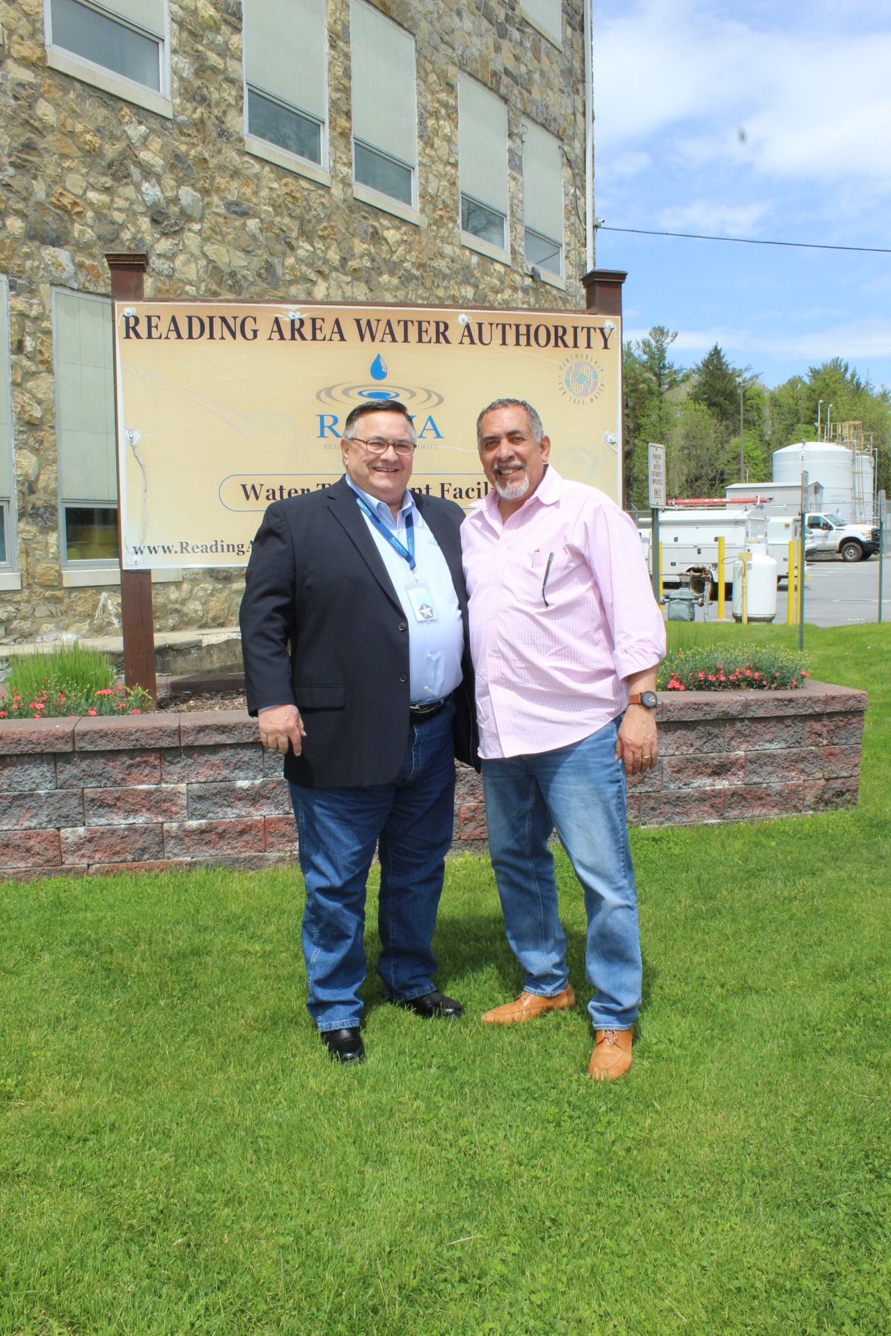 Two men stand in front of 