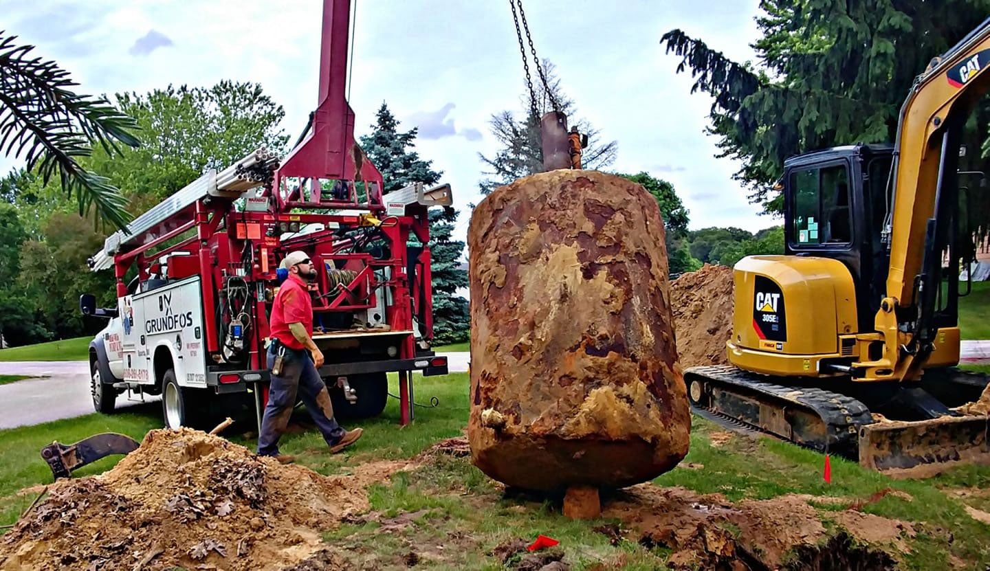 Removing An Old Water Tank — Sparta, WI — Mid-Wisconsin Pump & Well Service LLC
