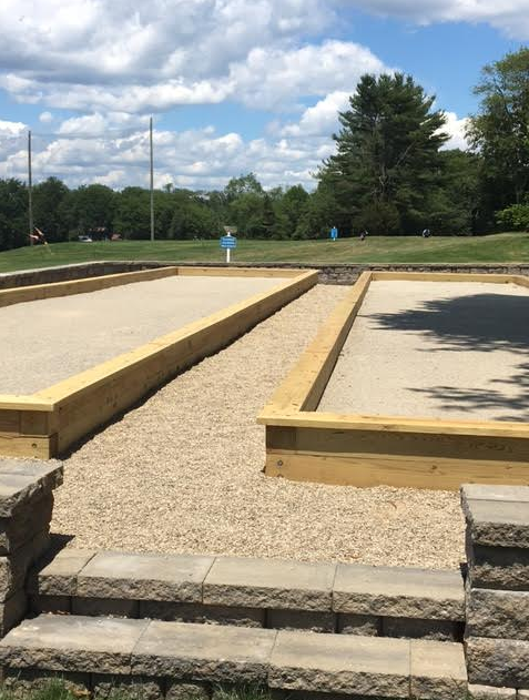 A gravel area with stairs leading up to it