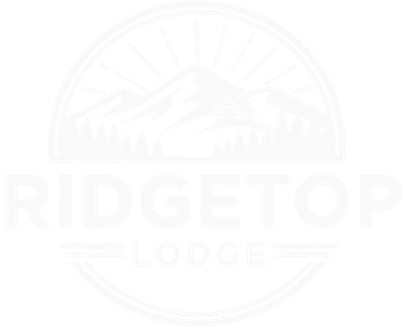 Ridgetop Lodge logo with mountain range and pine trees in a circle.