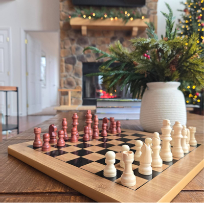 Wooden chess set on coffee table in cozy living room.