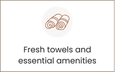 Two rolled-up towels icon with “Fresh towels and essential amenities” text.