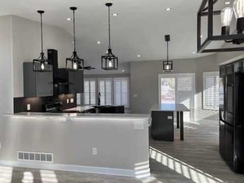 A kitchen with a large island in the middle of the room.