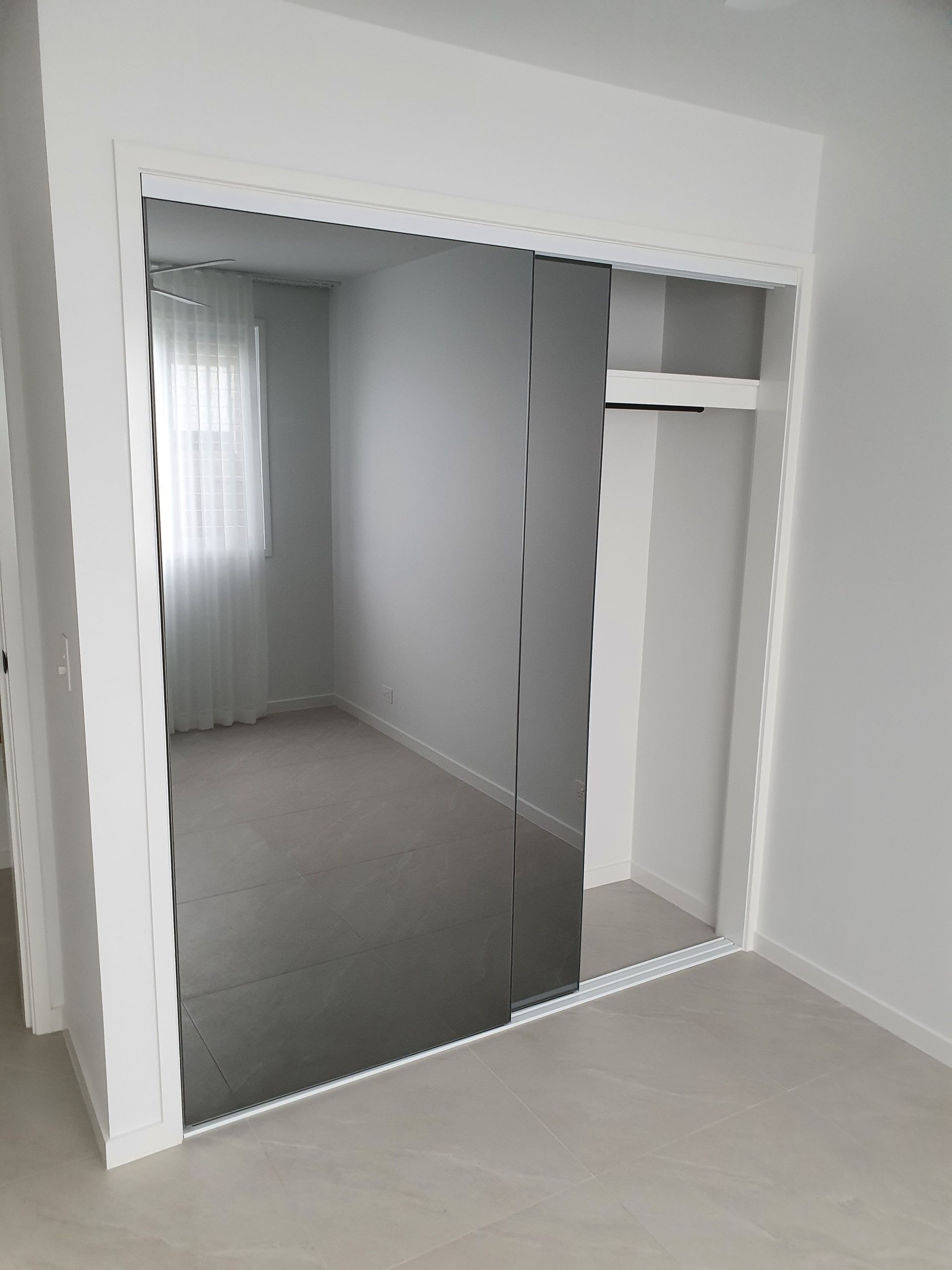 Comfortable bedroom with TV and wardrobes  — Sliding Wardrobe Doors in Tamworth, NSW
