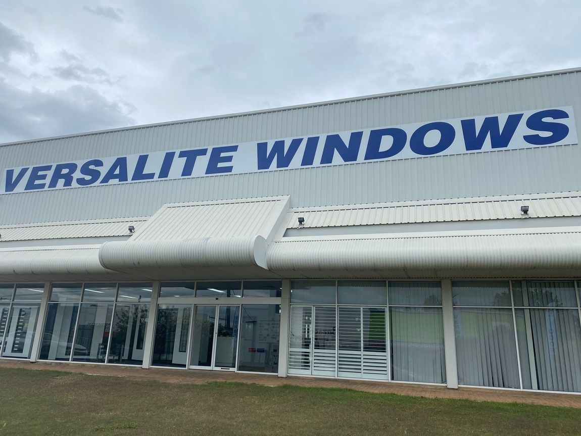 A building with a sign that says versatile windows