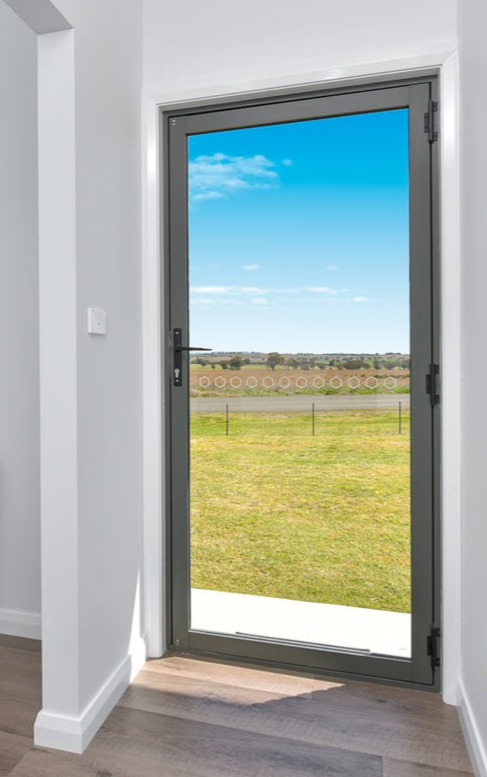 Entrance hallway with cabinet — Windows & Doors in Tamworth, NSW