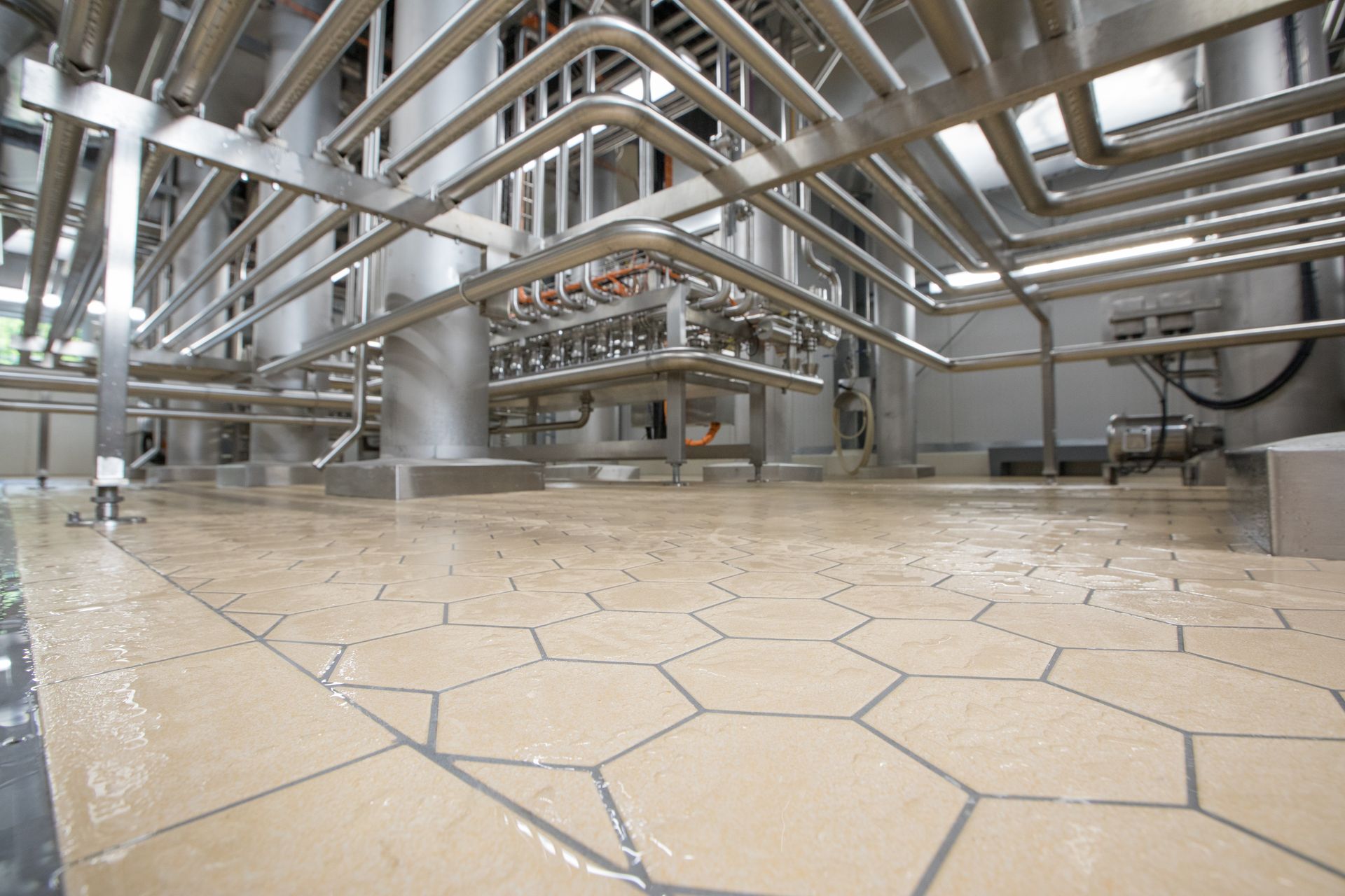 A large room with a lot of pipes going through it