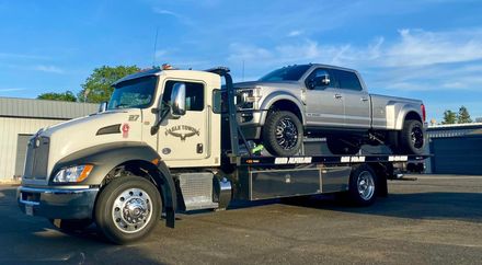 Tow Truck in front of Maserati Building — Lockouts in Sacramento, CA