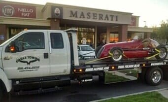 Tow Truck in front of Maserati Building — Lockouts in Sacramento, CA