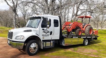 Eagle Towing Truck with White Car on the Back — Lockouts in Sacramento, CA