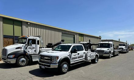 Eagle Towing Truck with White Car on the Back — Lockouts in Sacramento, CA