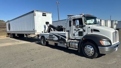 Eagle Towing Truck with White Car on the Back — Lockouts in Sacramento, CA