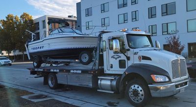 Eagle Towing Truck with White Car on the Back — Lockouts in Sacramento, CA